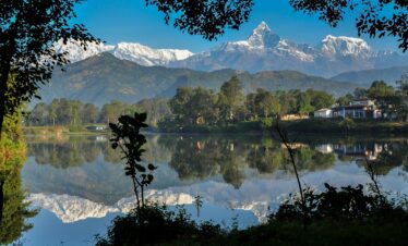 Breathtaking view of Machhapuchhare reflecting in Phewa Lake, Nepal.