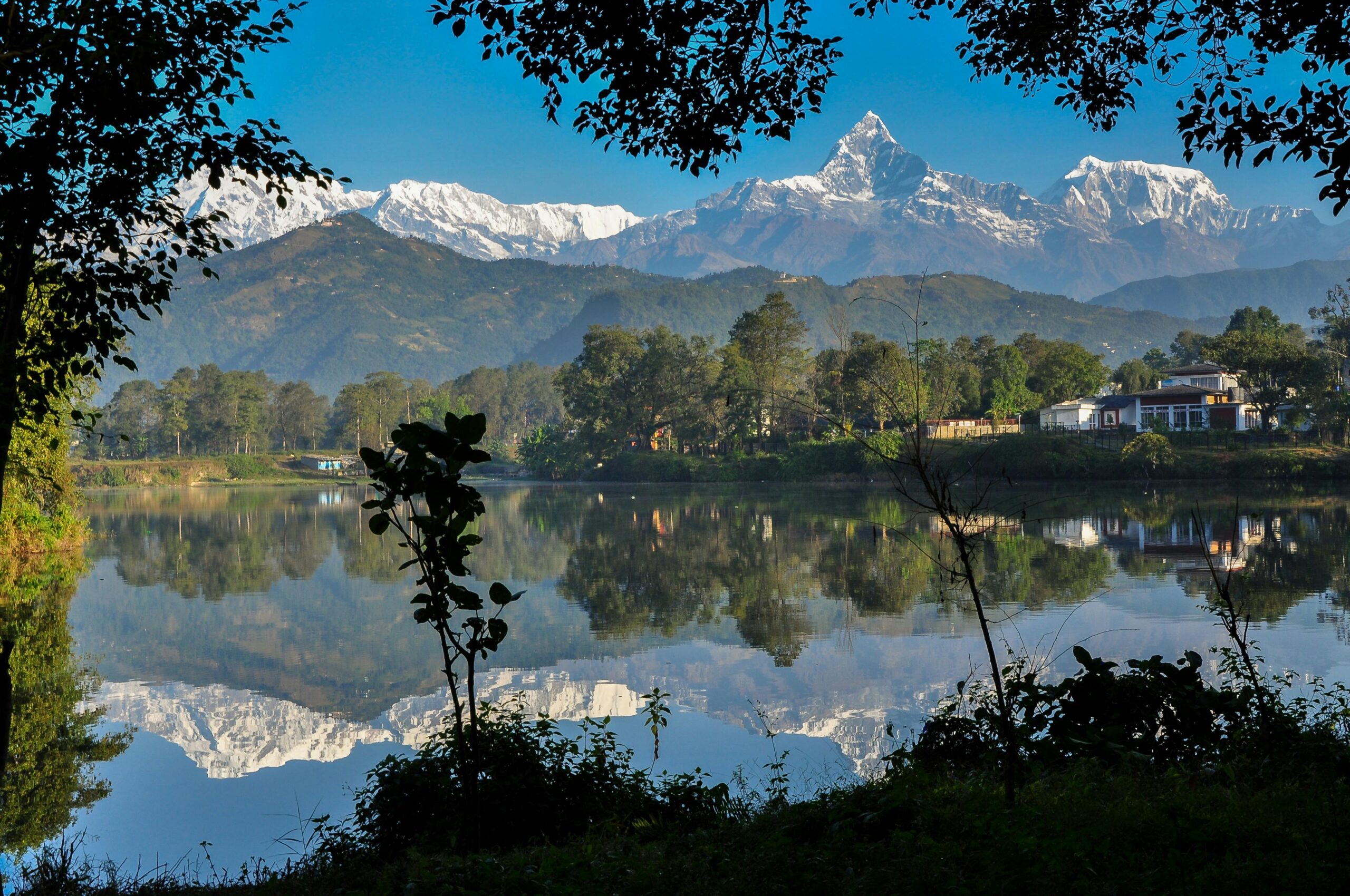 Breathtaking view of Machhapuchhare reflecting in Phewa Lake, Nepal.